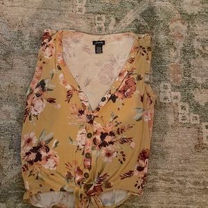 Yellow tank top, with flowers. Low cut.  Brand: Justify. Size: small